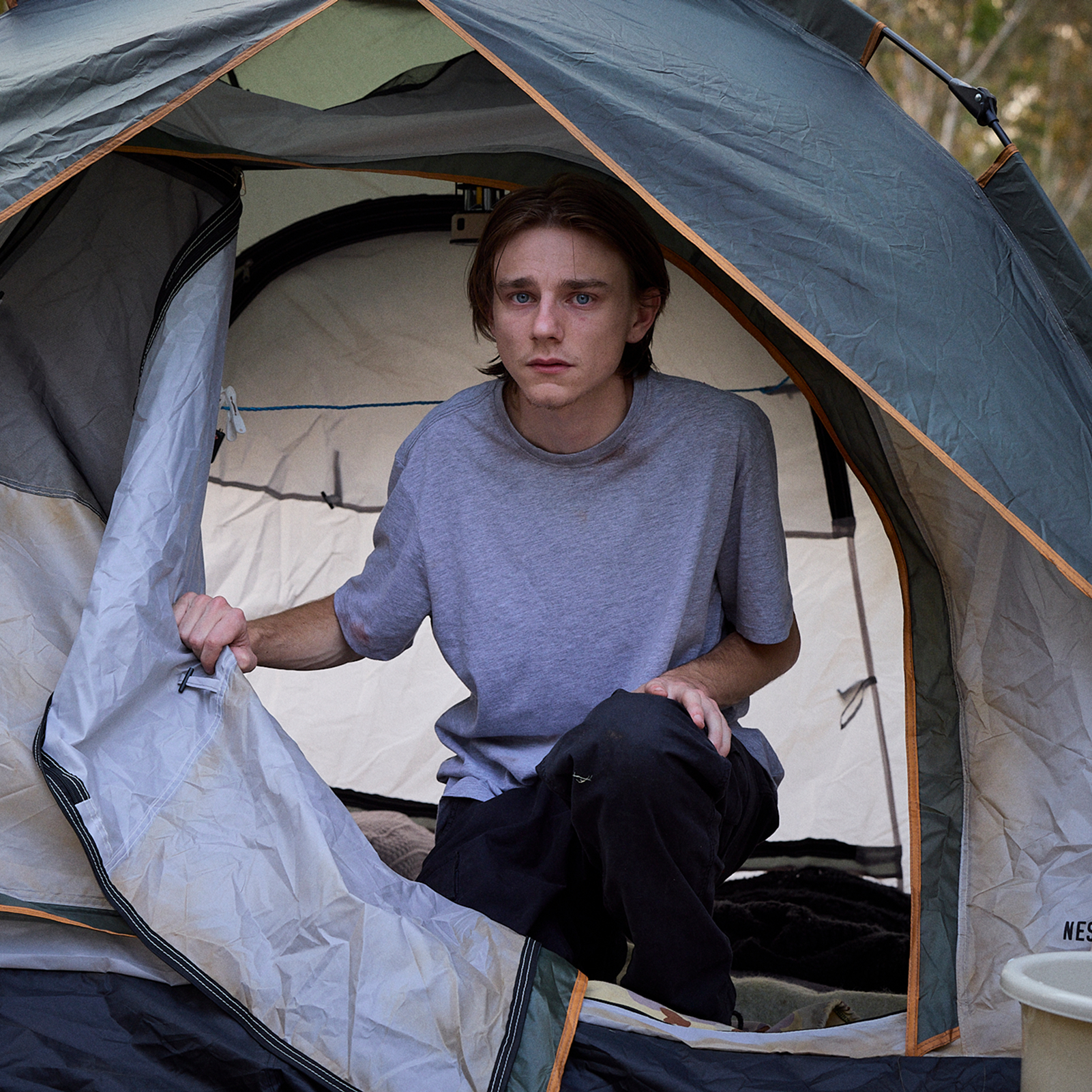 Young man in a tent