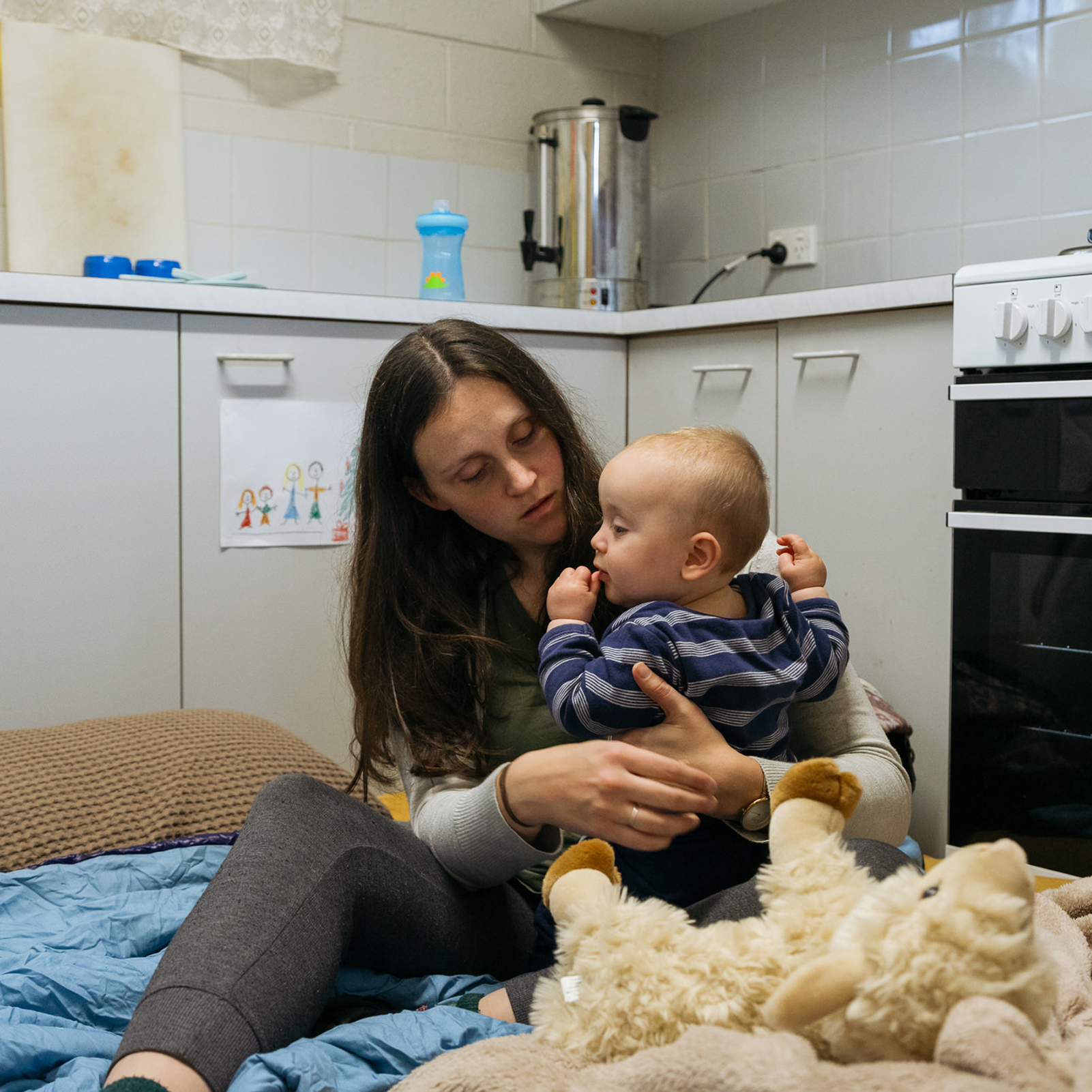 Mother and child on kitchen floor